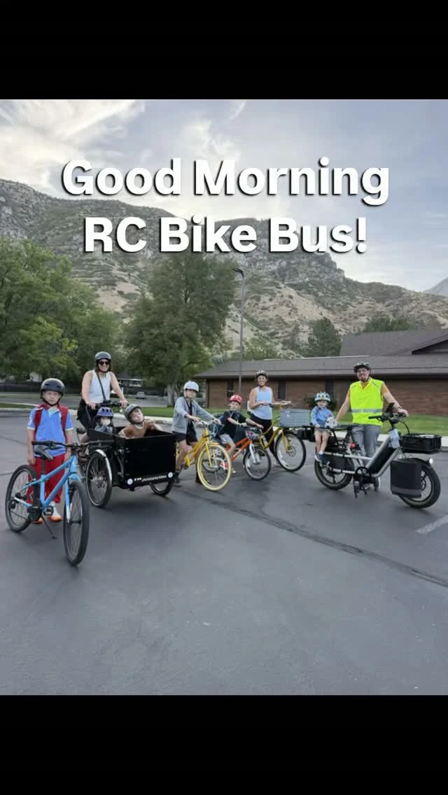 Kids and adults posing with bikes at the Rock Canyon Bike Bus.