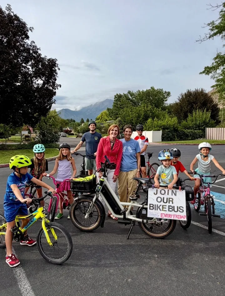 Provo Mayor Marsha Judkins and Provo City School District Superintendent Wendy Dau stand with kids and adults from the Rock Canyon Elementary bike bus.